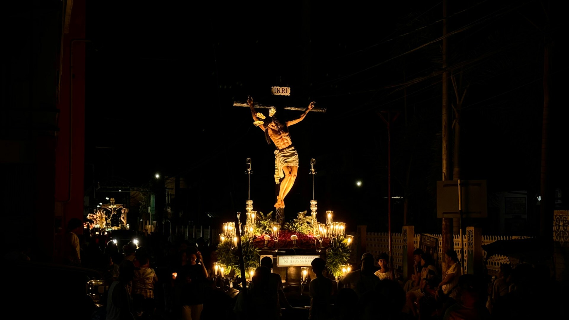 Religious Procession with a Crucifix at Night
